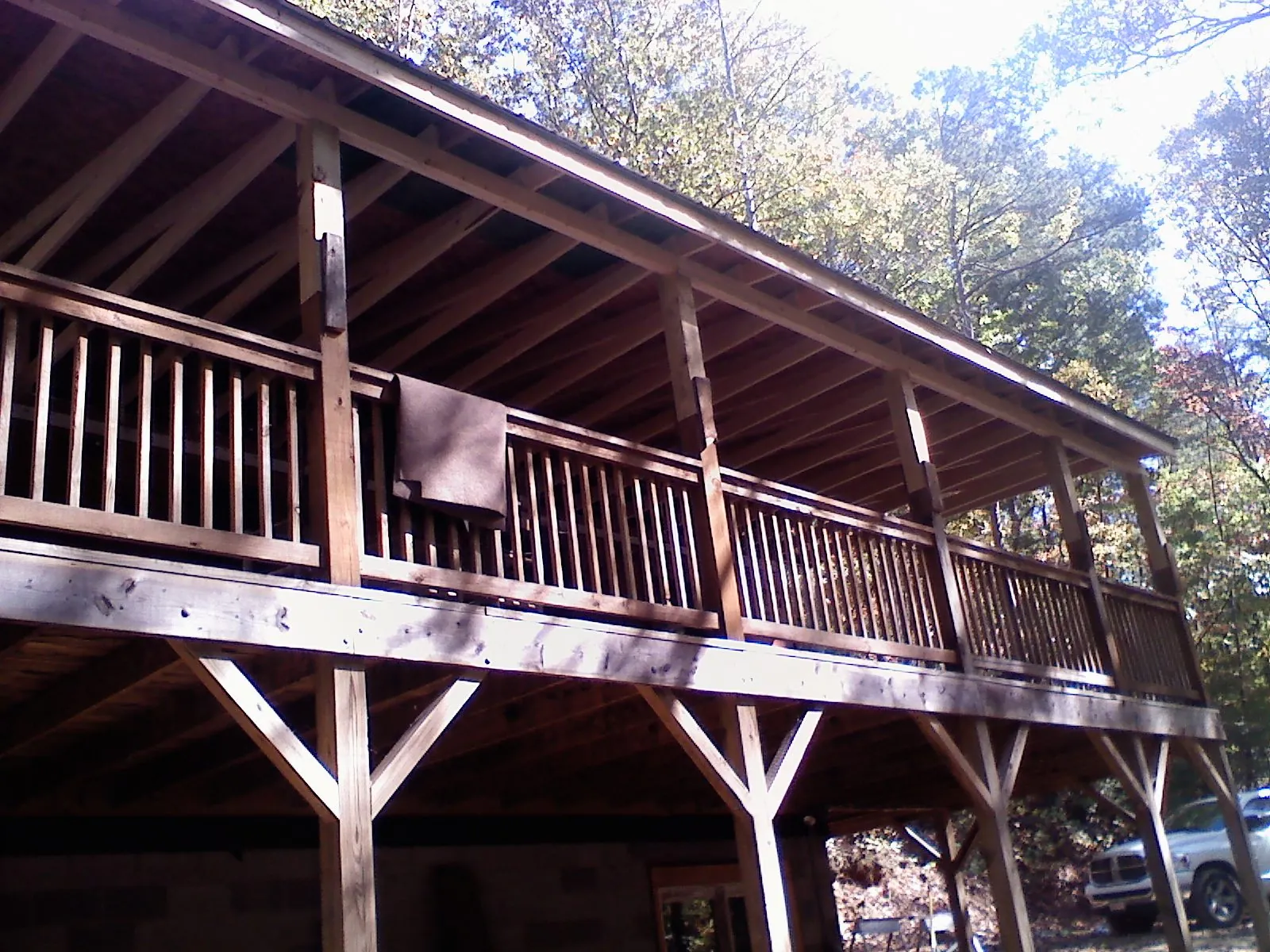 Timber framing under a new elevated porch and deck — Roof Leak Repair in Klamath Falls by Roofing Brothers